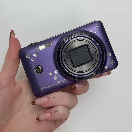 Used E1486TW Purple Digital Camera